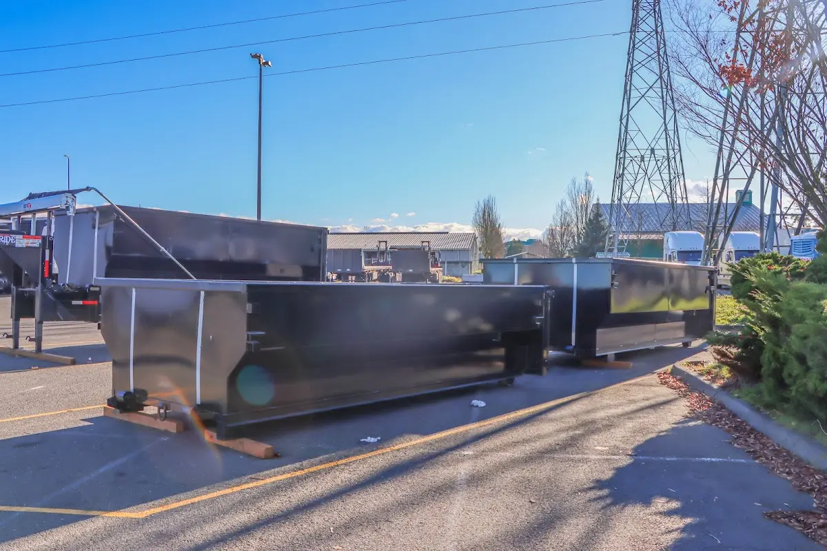 Roll-off dumpster ready for waste disposal at job site for 2 Yard Dumpster Rental in Henniker